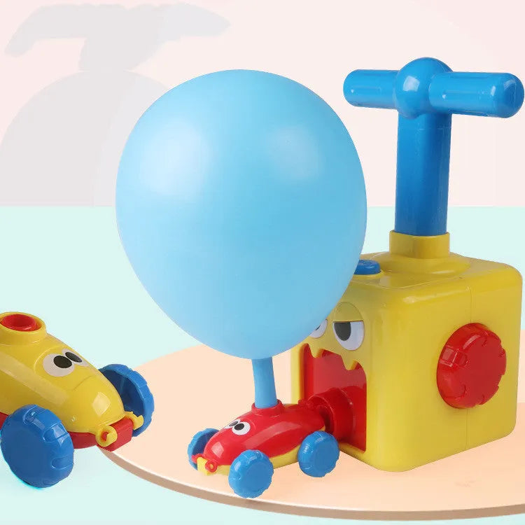 Balloon launch tower toy car with inflated balloon on a white surface