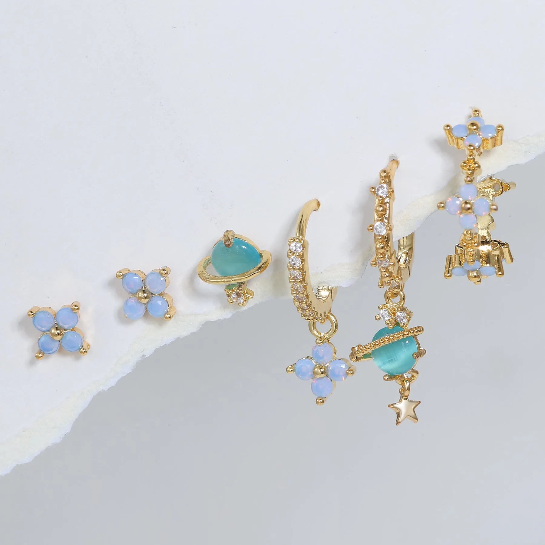 Gold and silver flower stud earrings with blue zircon mosaic accents in Japanese Korean style