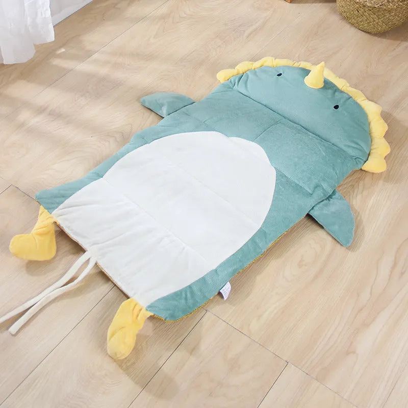 Detachable cool cat bed with ice pad in Green Dinosaur pattern on a indoor surface