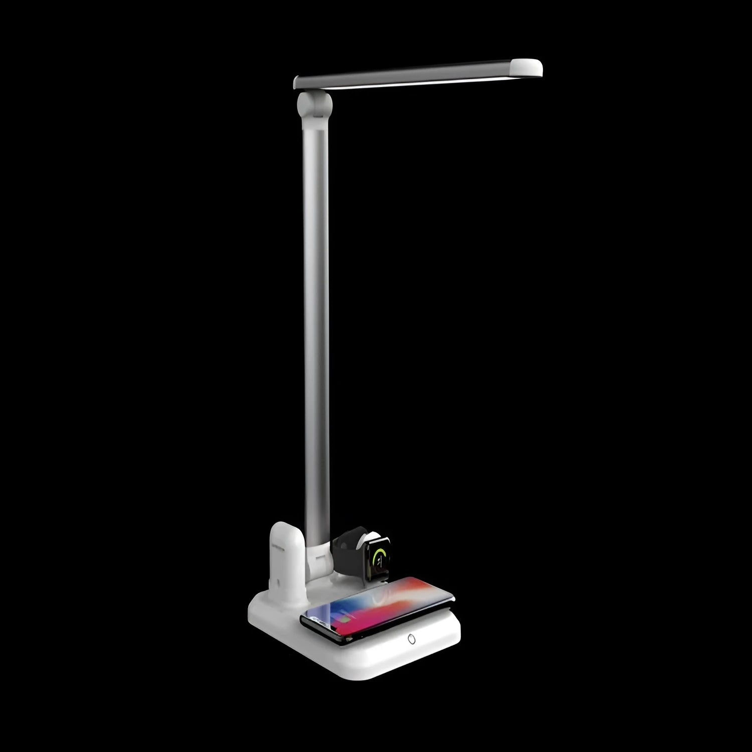Black and white 4-in-1 LED desk lamp on a desk, showing wireless charging area and USB-C port.