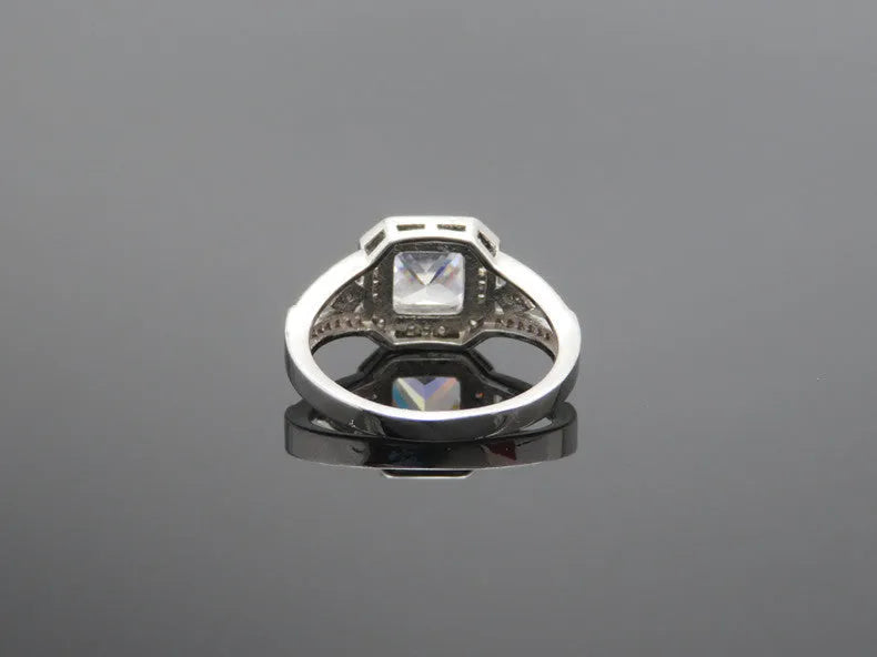 Geometric hollowed zircon ring in platinum colour on copper with quadrilateral design