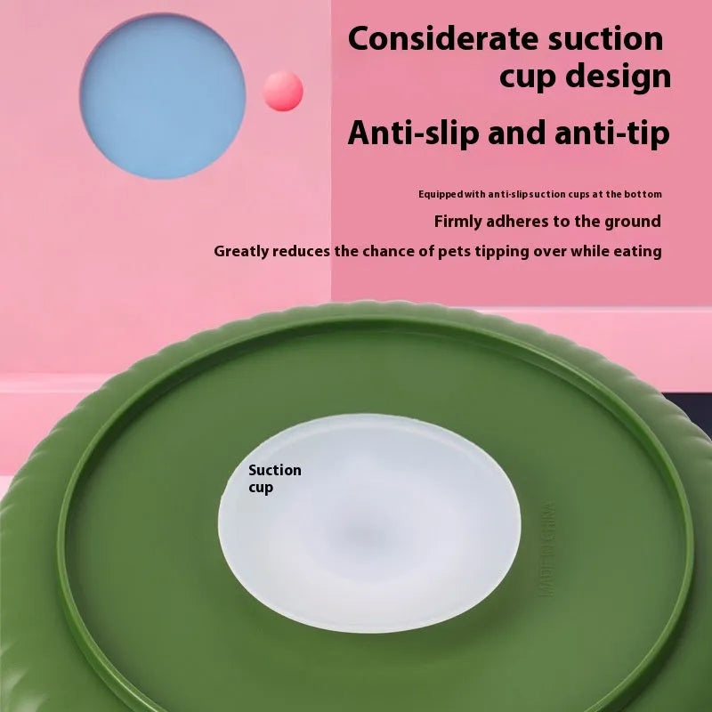 Grey plastic pet bowl with rotating windmill-pattern slow feeder licking mat inside