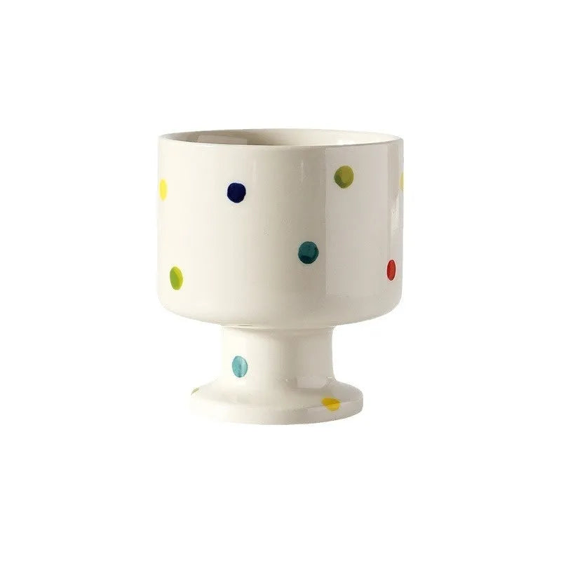 Hand-pinched irregular ceramic mug with modern minimalist design in solid colour