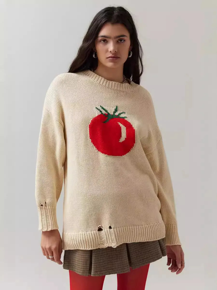 Women's beige loose-fit acrylic Jacquard knit sweater with round neck and long sleeves laid flat.