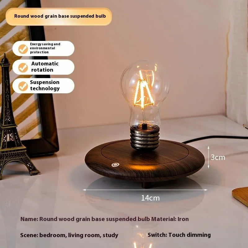 Suspended bulb night lamp on black wood grain base measuring 11cm for desktop decoration