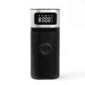 Black portable wireless smart air pump with USB cable, 15cm tube, and nozzle accessories on a grey background.