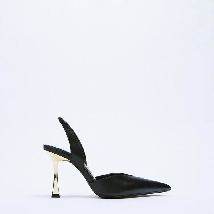 Apricot and black patent leather pointed high heels with a shallow-cut vamp, shown from the side.