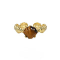 Women's adjustable silver ring with sculpted shell design and tiger eye stone in gold finishes