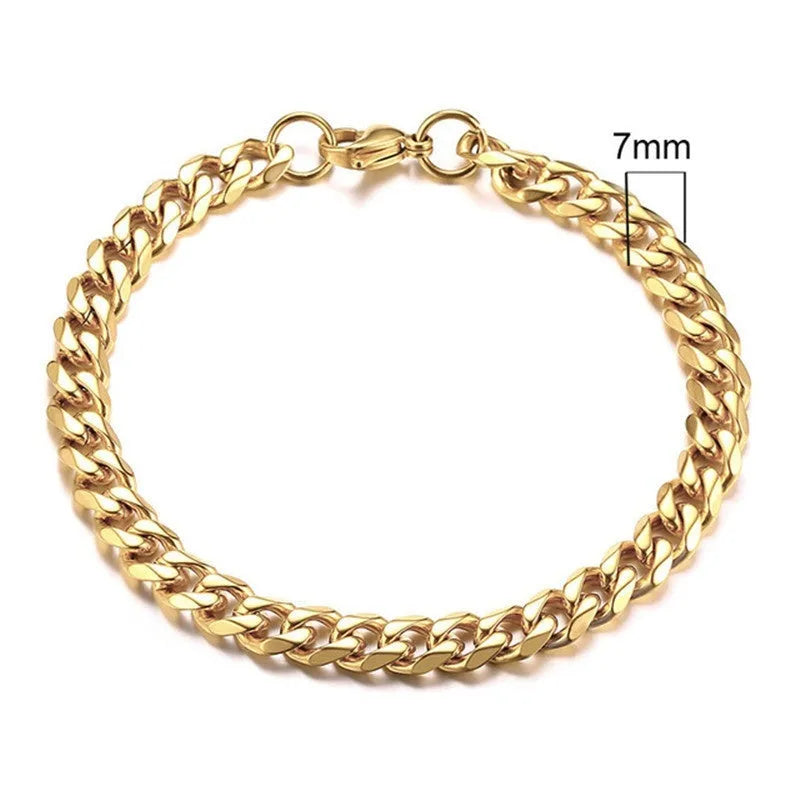 Six-sided geometric Cuban link metal bracelet in gold, black, and steel colour finishes.