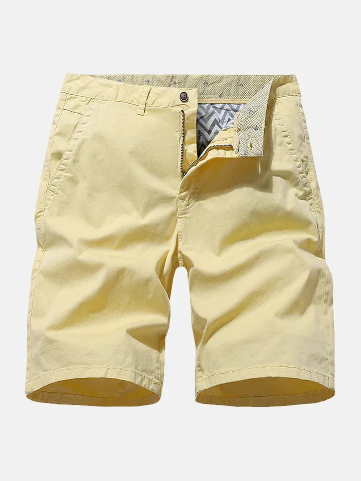 Men's blue denim loose-fit casual shorts with a straight leg and no belt, laid flat.