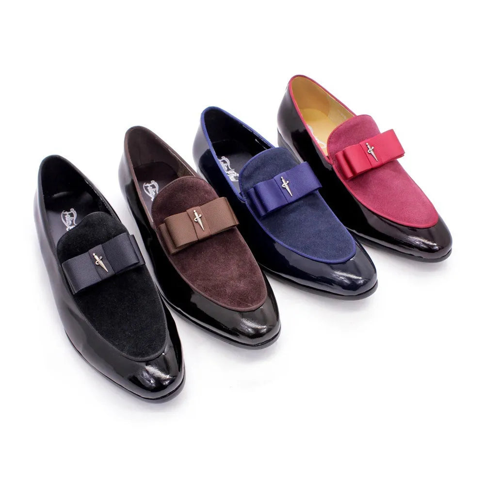 Men's black patent leather low-top dress shoes with a tassel detail on the front.
