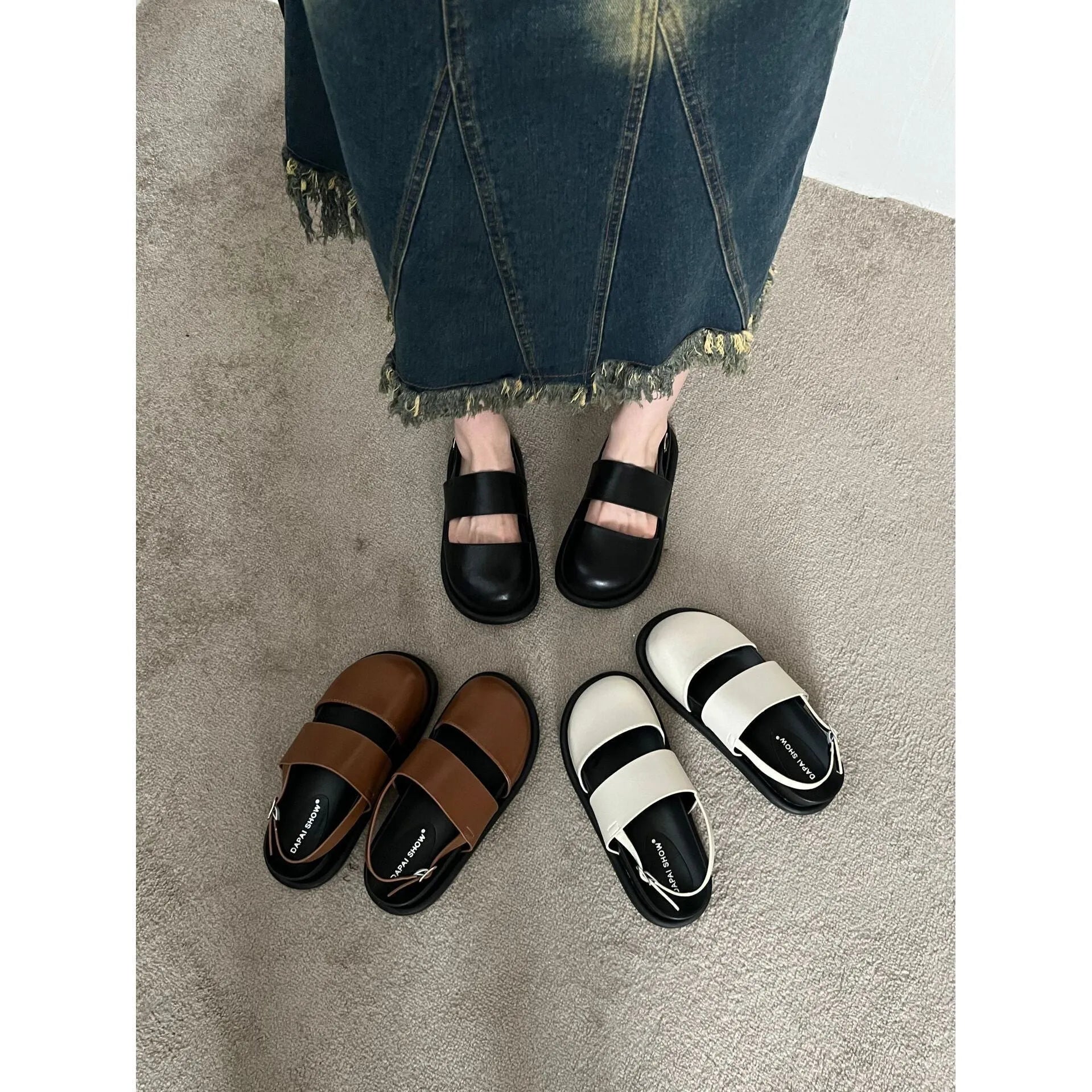 Retro style closed toe sandals with a single ankle buckle strap in apricot colour.