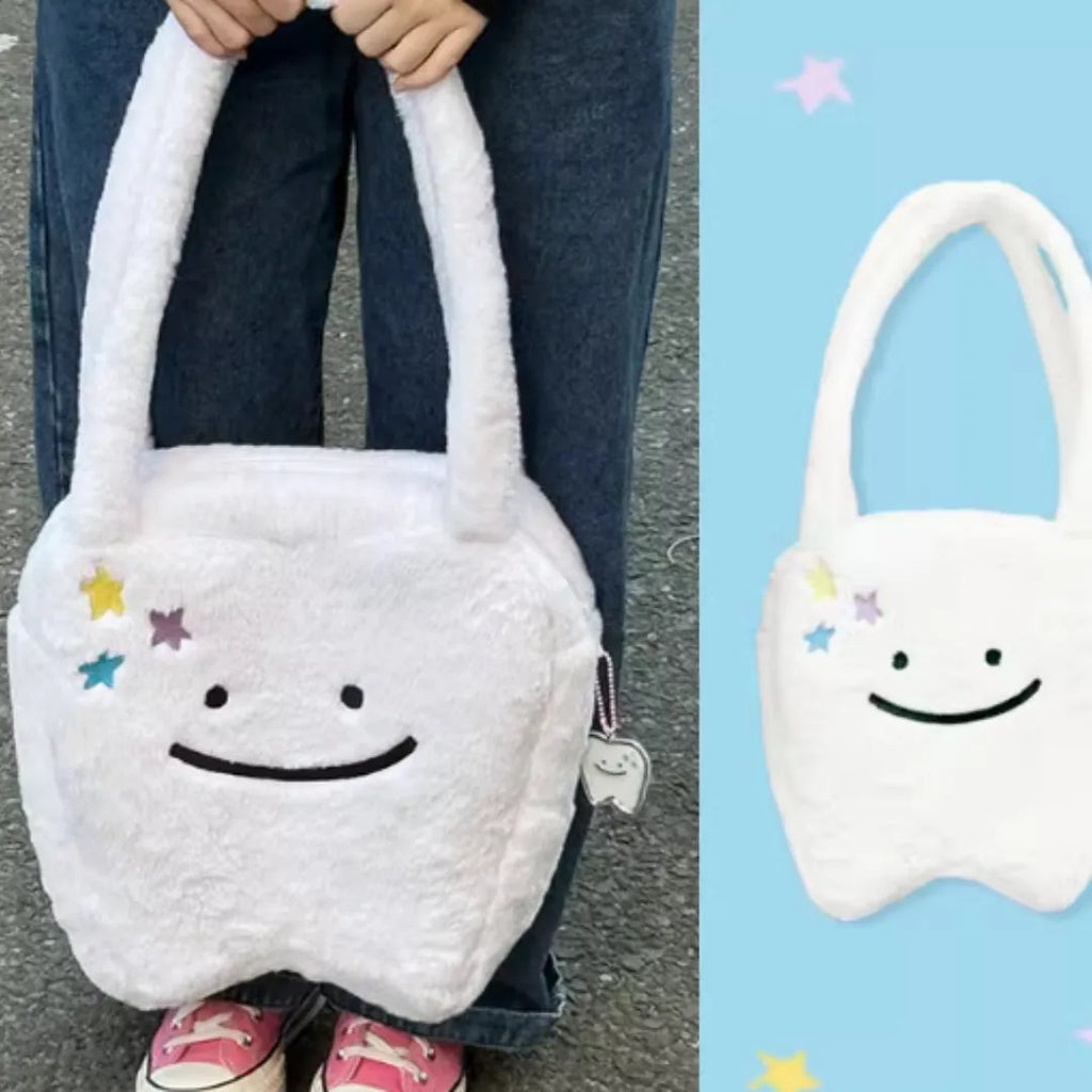White plush shoulder tote bag with cute tooth design and zipper closure
