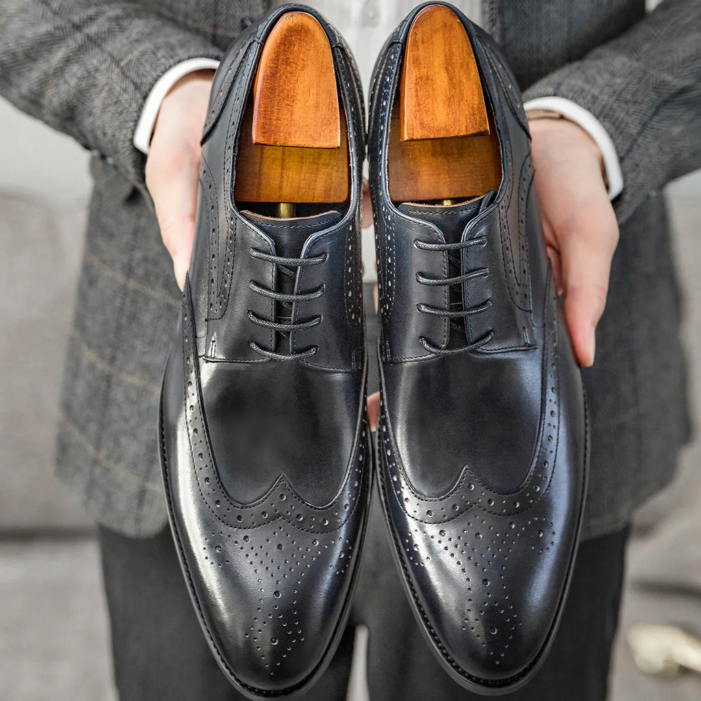 Men's burgundy British Brock pointed toe formal leather shoes on a white background.
