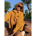Dopamine yellow and black plaid pattern on a loose-fit men's and women's cardigan-style shirt.