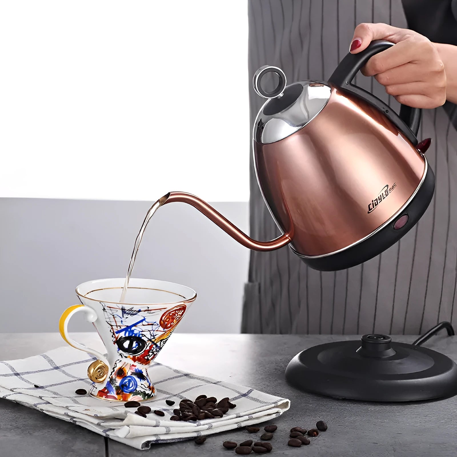 Stainless steel automatic electric kettle in gold colour with touch controls and 1 litre capacity