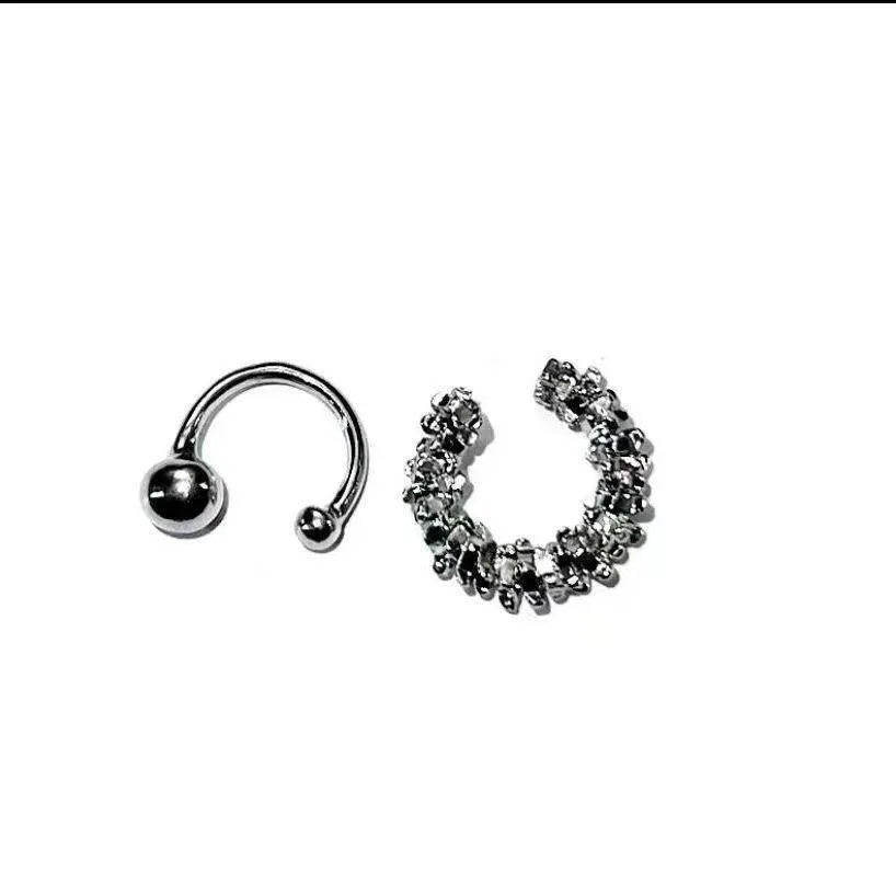 A pair of silver geometric irregular-shaped earrings with a frosted finish and clip-on fastenings.
