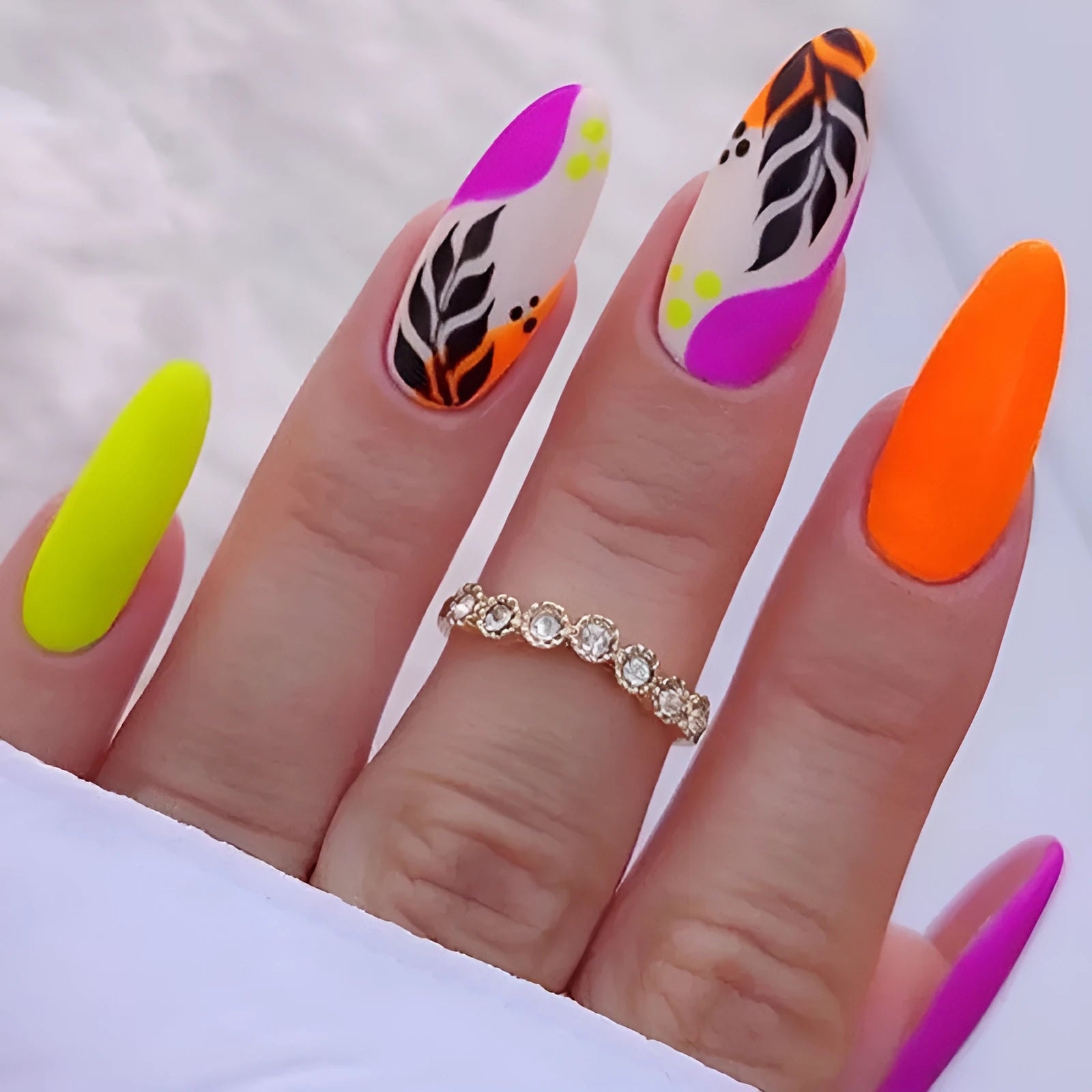 Wear Armour Medium Almond Frosted Nail Stickers set showing four patterns: French leaf, colourful plating, macaron, and leopard print.