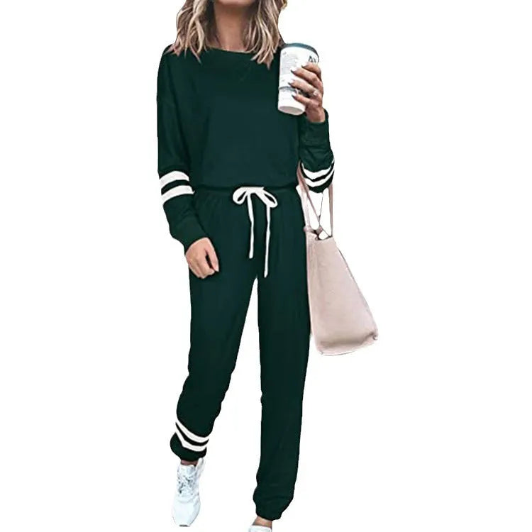 Women's loose-fitting casual suit set in a solid colour, comprising a long-sleeve top and matching trousers.