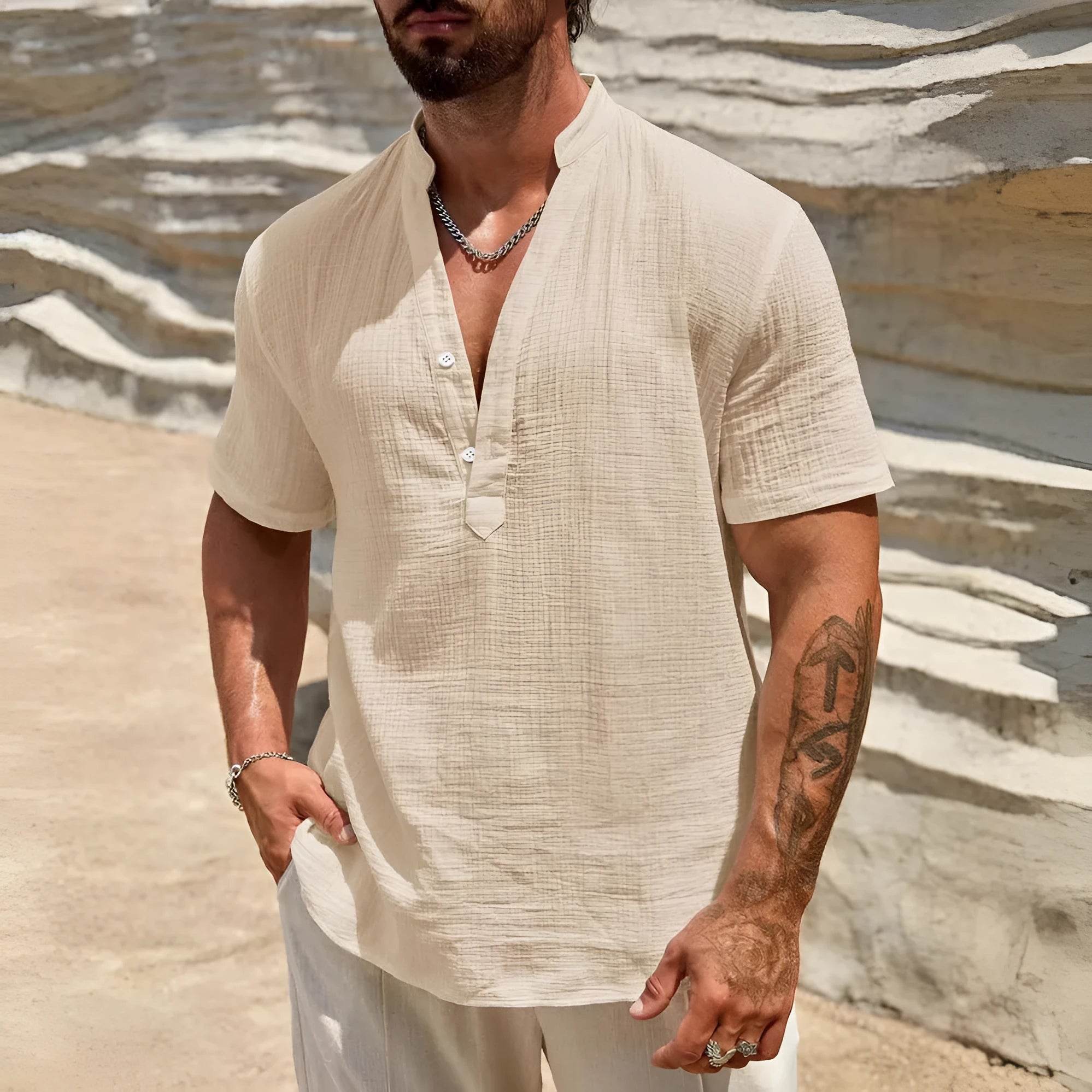 Men's solid colour stand collar short-sleeved shirt with slit detail in light blue.