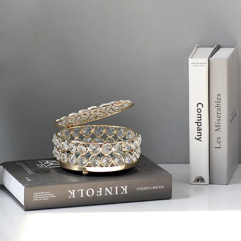 Crystal glass jewellery box with transparent sides and a French gold metal frame.