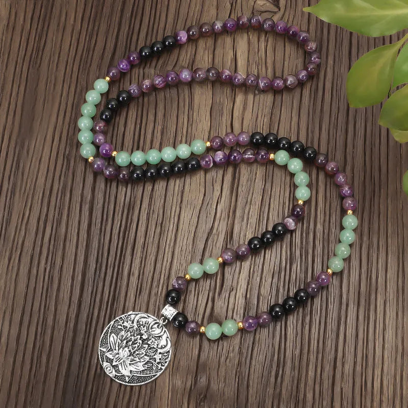 Yoga lotus pendant necklace with handmade stone beads and matching bracelet on adjustable chain.