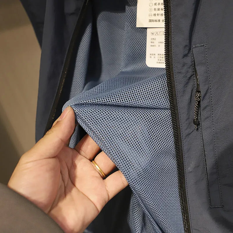 Men's thin nylon vest in straight cut with side pockets, shown in Army Green colour.