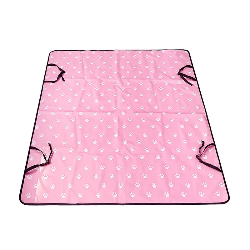 Washable cloth car pet mat for rear seat protection with dog bone print design.