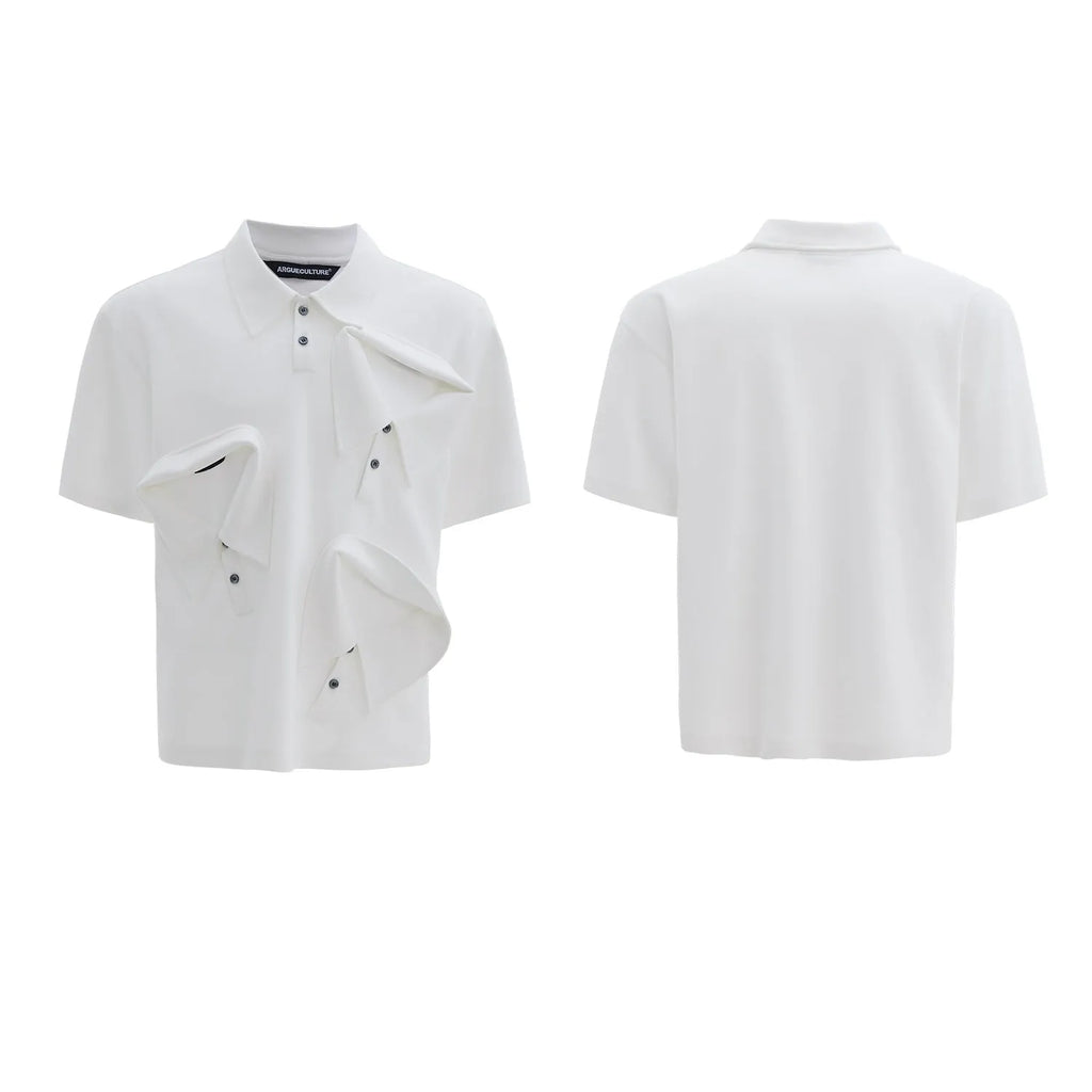 Man modelling a loose-fit black polo shirt with a deconstructed collar and a geometric pattern on the chest.