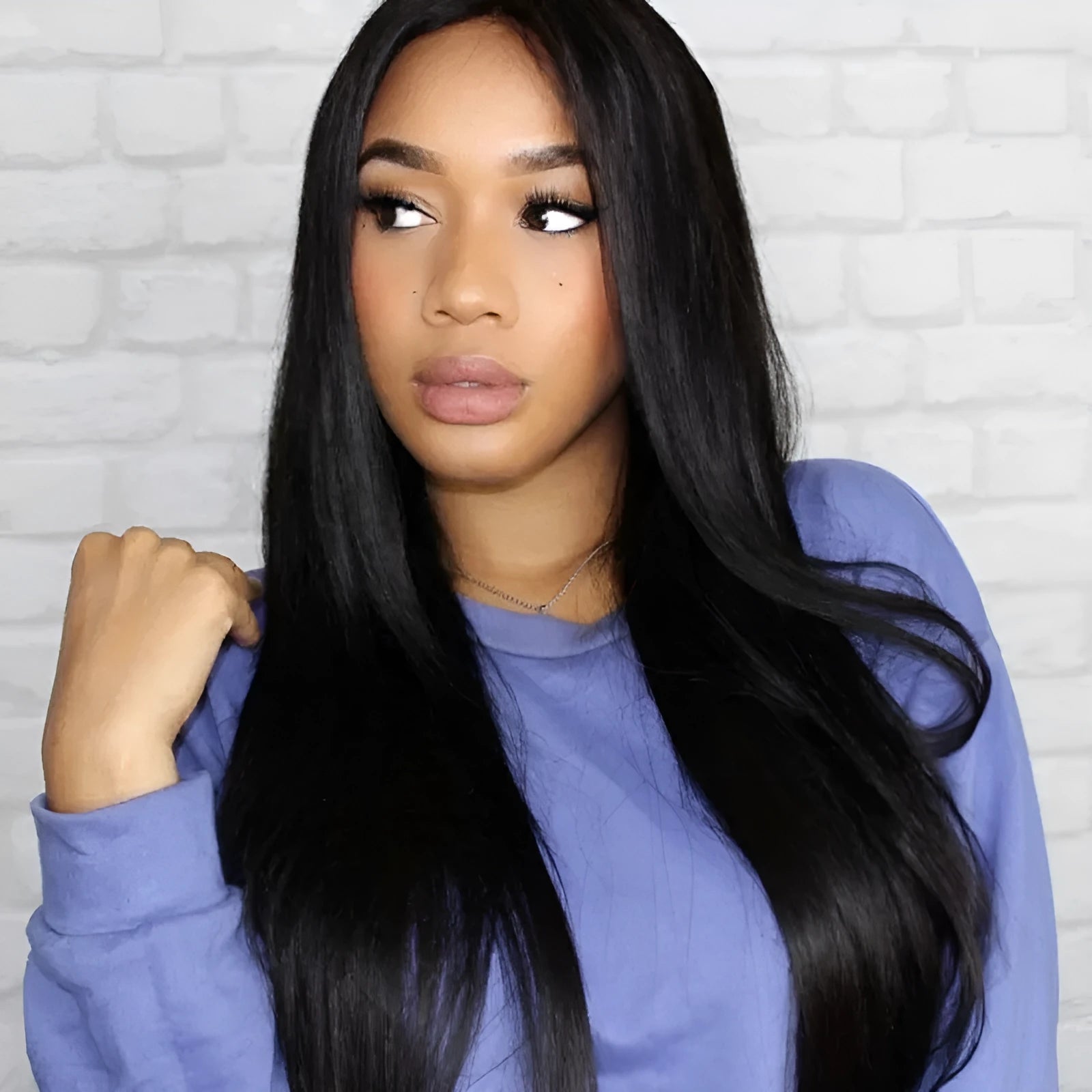Long straight black wig with centre-parted bangs on a mannequin head