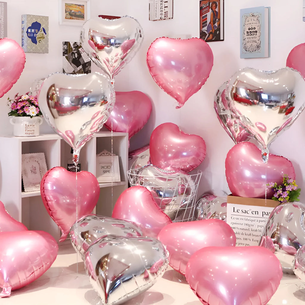 Five peach heart-shaped aluminium balloons with metallic red finish for party decoration