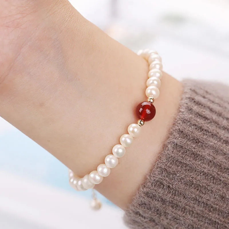 Handmade Chinese style glass bracelet with bamboo joint beads in a red Lvzhu Duobao design.