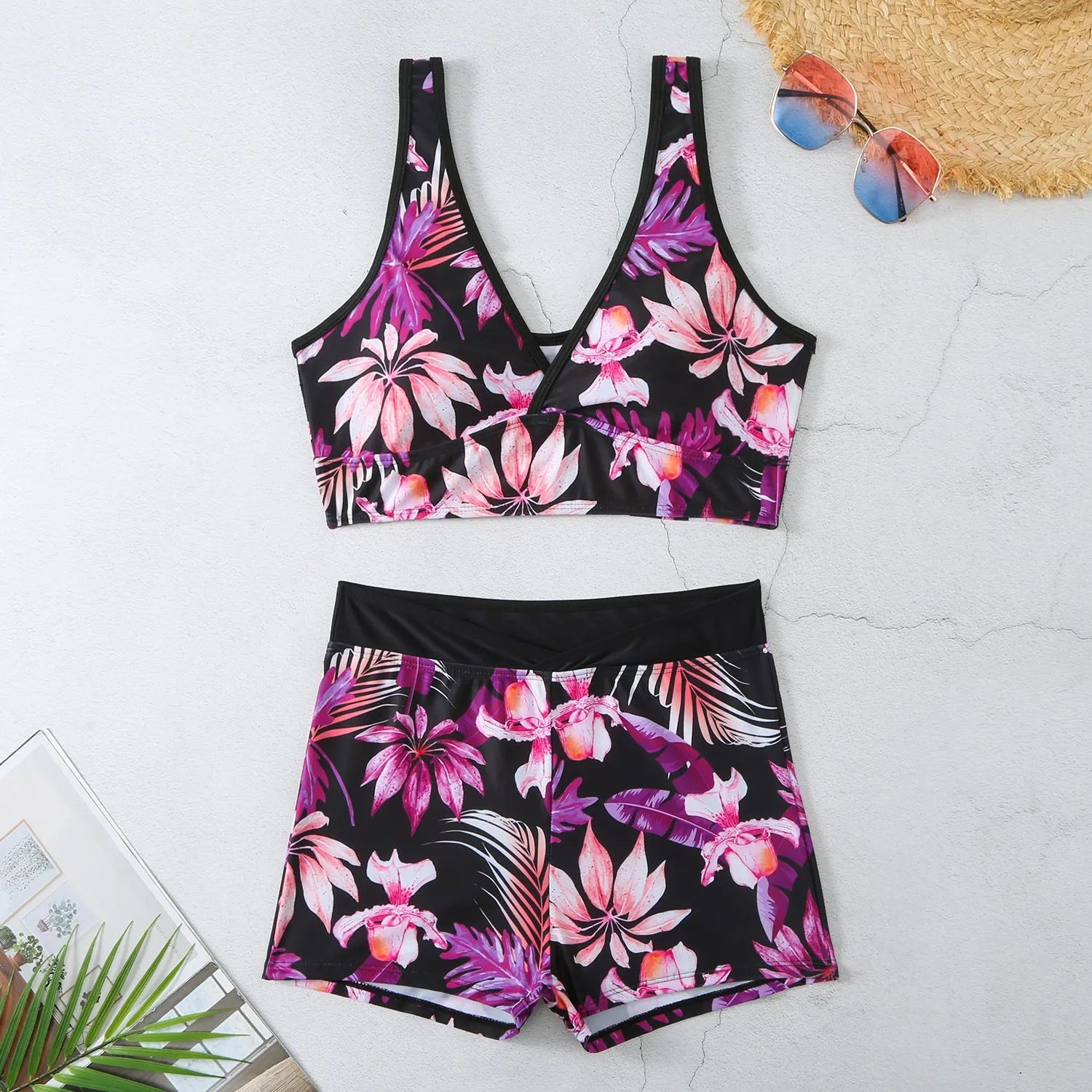 Women's two-piece printed swimsuit set with sleeveless top and boxer shorts in a multi-colour design.