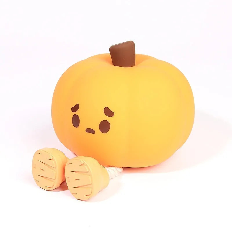 Pumpkin small night lamp in jack-o-lantern style, silicone and plastic construction, rechargeable with USB