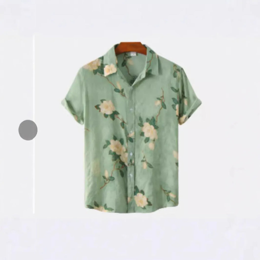 Man wearing a short sleeve lapel collar Hawaiian shirt with a blue floral print.