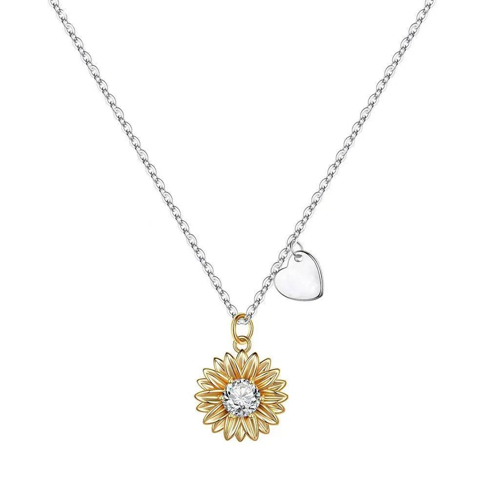 Sterling silver sunflower necklace with geometric daisy petal pendant on an adjustable cross chain.