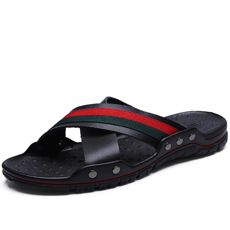 Men's black cowhide leather beach sandals with a non-slip PU sole on a wooden deck.