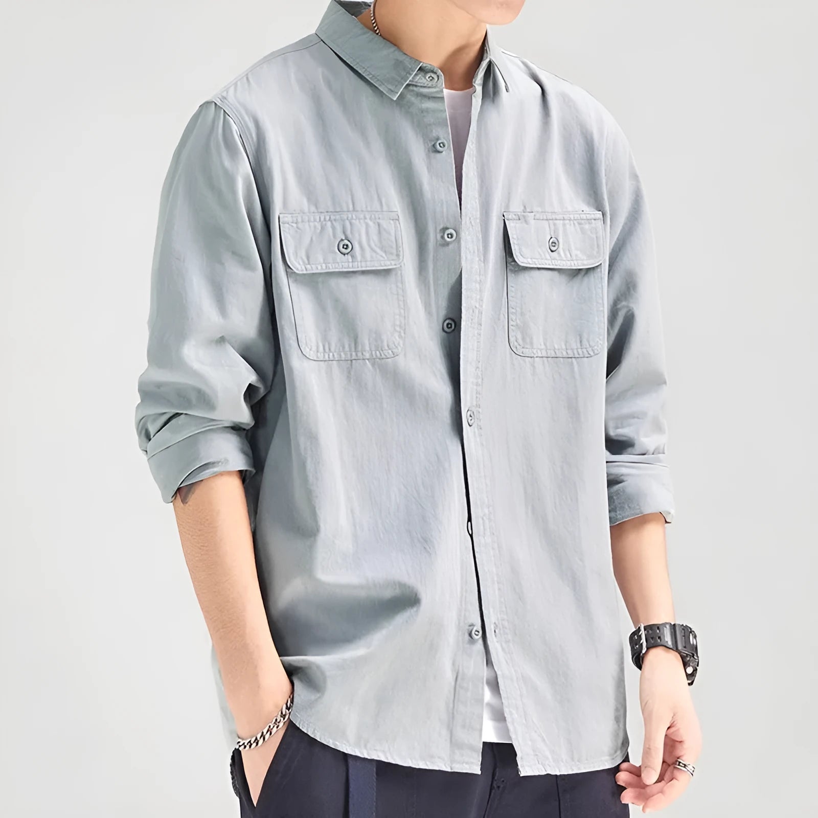 Man wearing loose fit long sleeve shirt overalls in cardigan style, made from polyester fabric