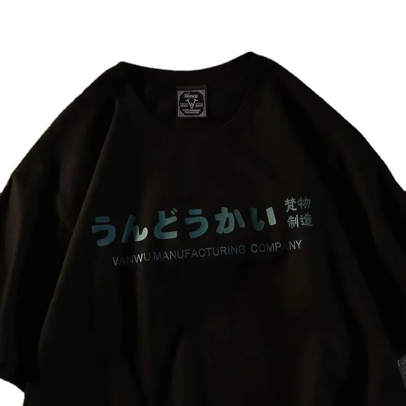 A loose-fit black cotton short sleeve t-shirt laid flat, showing its pullover style and regular sleeves.