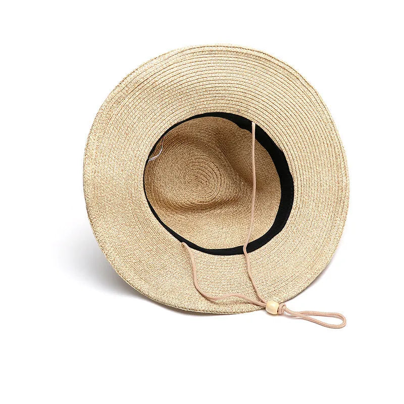 Men's foldable straw sun hat with wide brim in mixed beige colour on neutral background