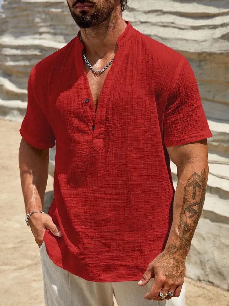 Men's solid colour stand collar short-sleeved shirt with slit detail in light blue.