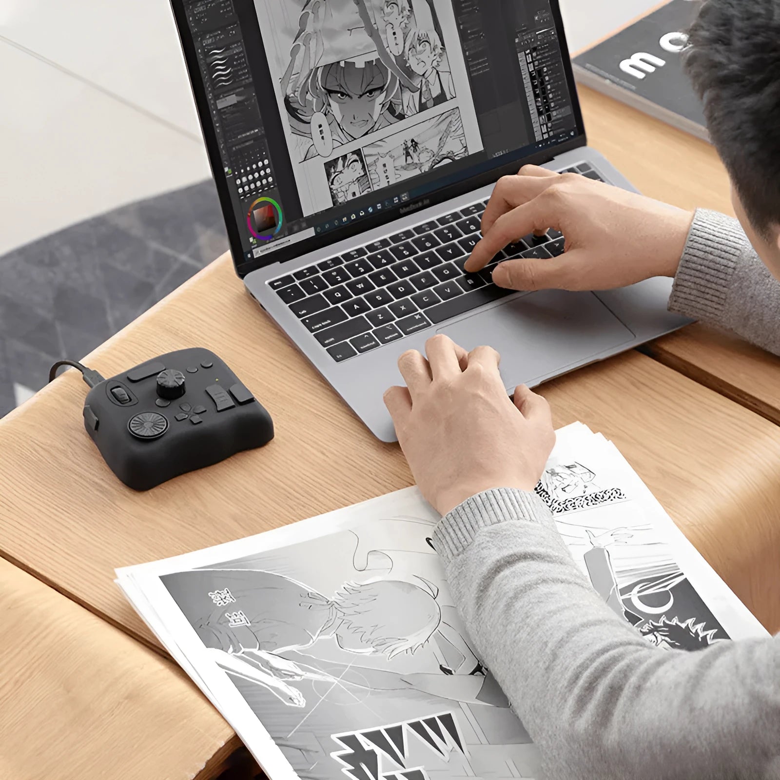 TourBox NEO black digital tablet auxiliary keyboard for video editing on a desk