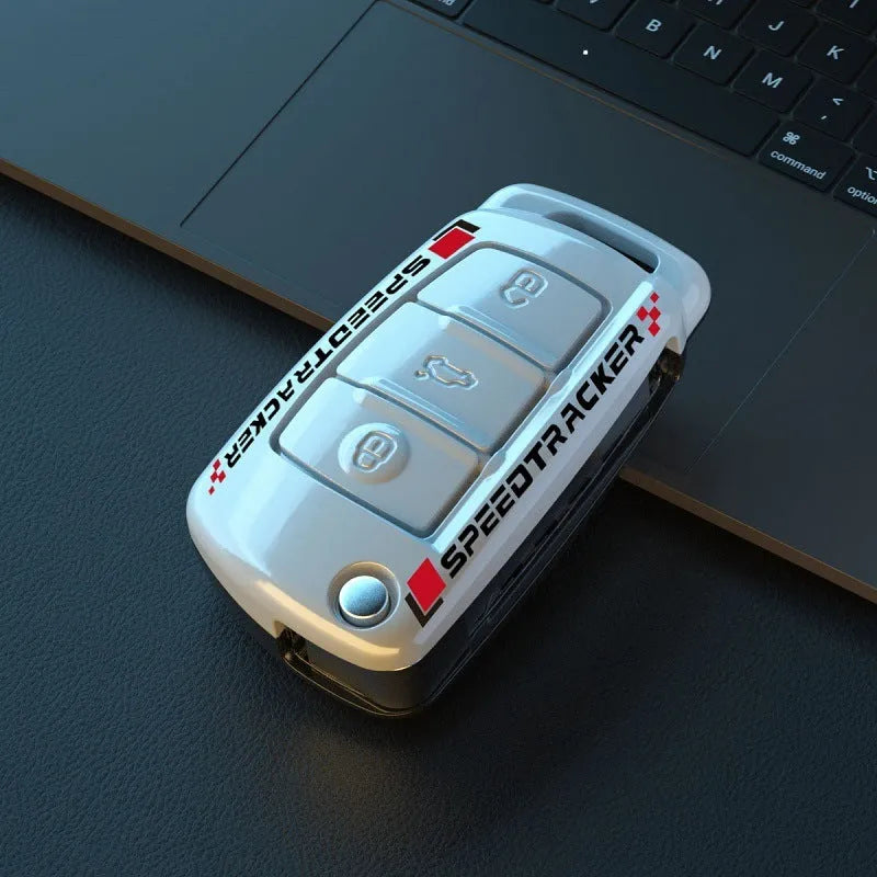 White and carbon coloured car key holders with a carbon fibre texture and mirror surface.