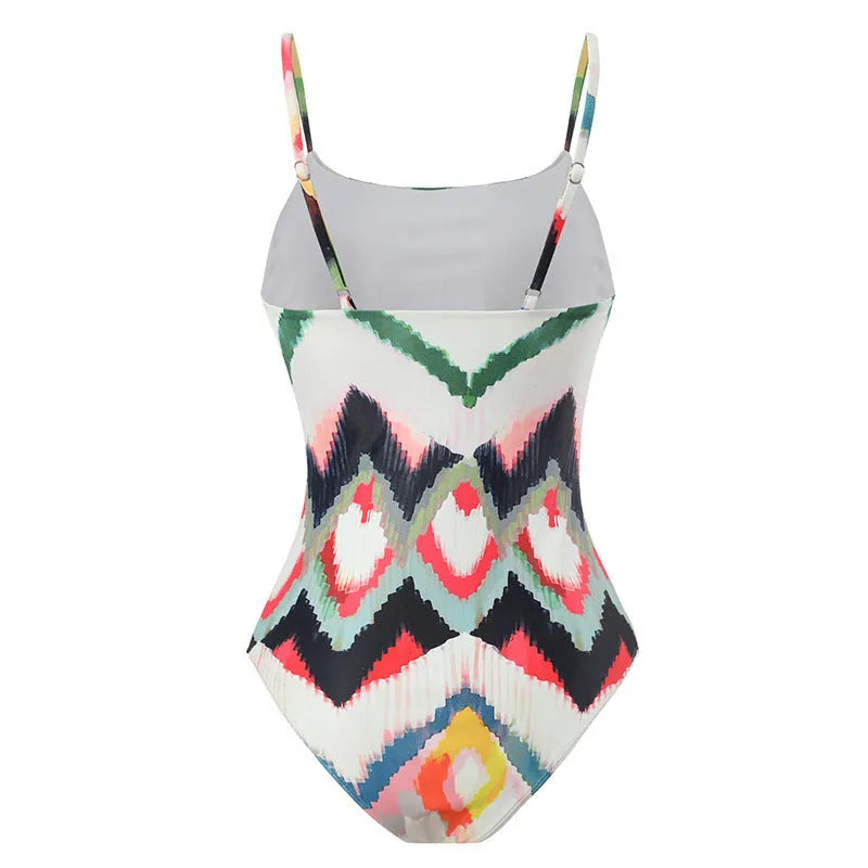 Women's two-piece striped swimsuit with matching hip skirt on beach