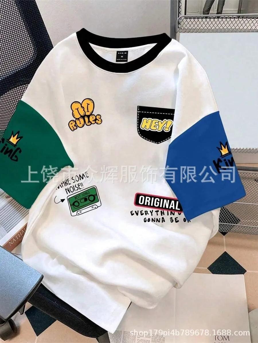 Man wearing a loose-fit casual t-shirt with a printed letter design in a trendy colour.