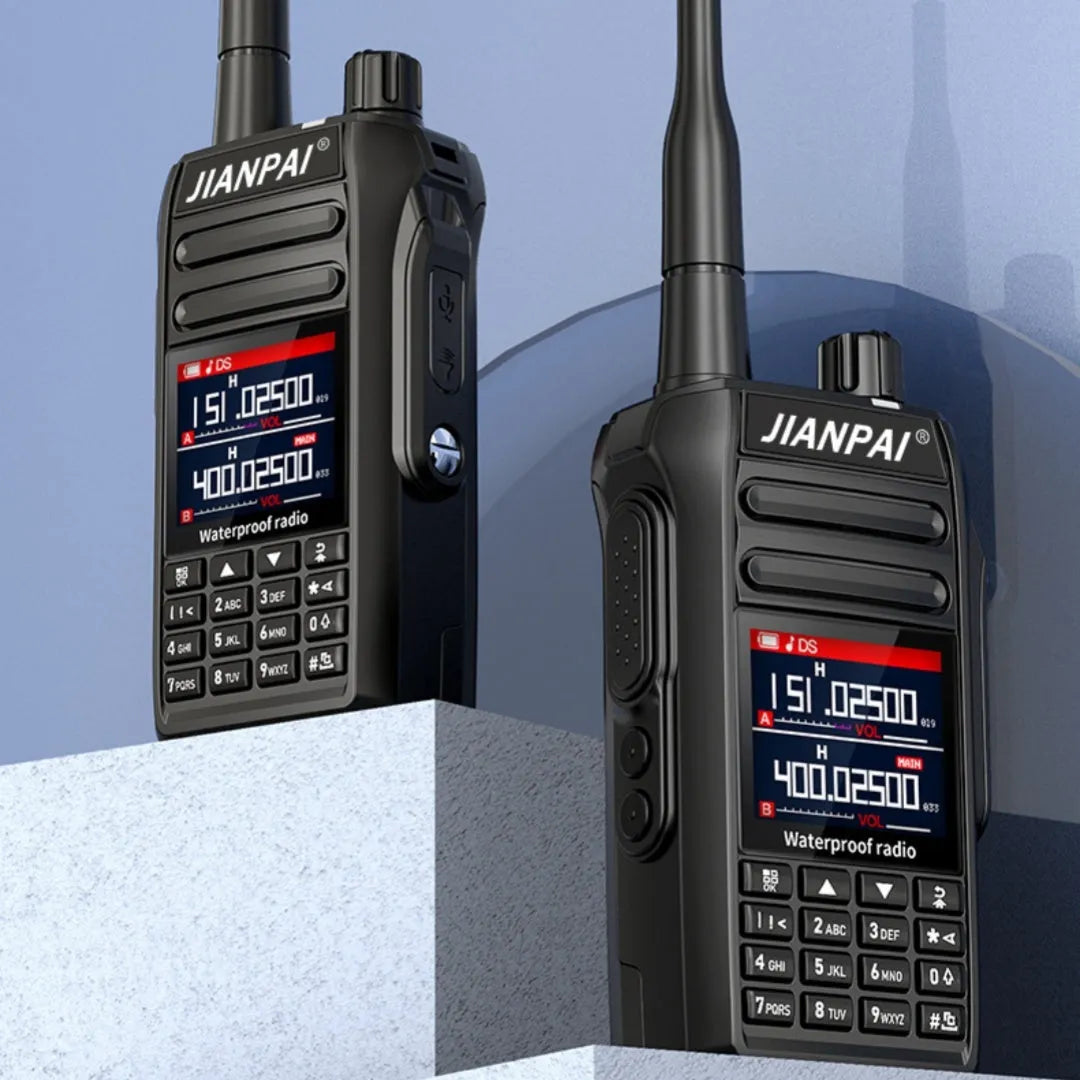 Black Interphone aviation communication headset with microphone, battery, antenna, and charging accessories on a flat surface.