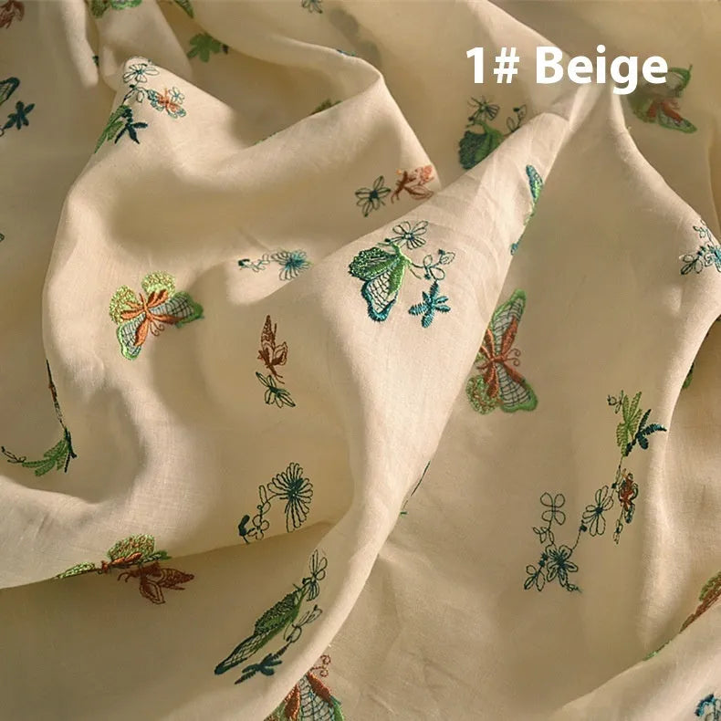 100% ramie embroidery fabric showing texture in beige, dark green and grass green colours