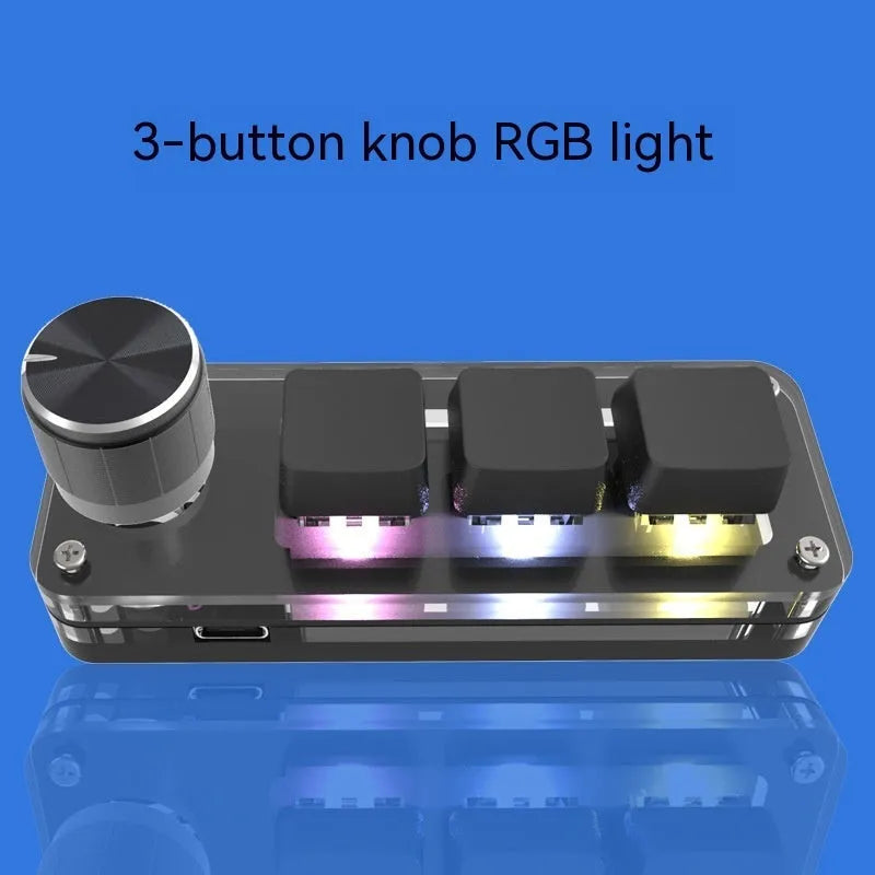 Black custom keypad with RGB backlit keys for copy and paste functions on a desk