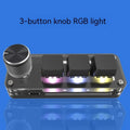 Black custom keypad with RGB backlit keys for copy and paste functions on a desk