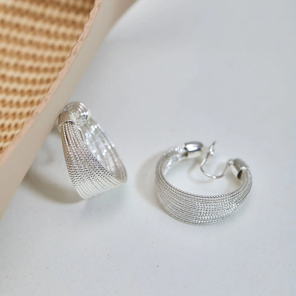 Copper geometric multi-layer bracelet earrings in silver or gold finish, available as clip-on or stud styles